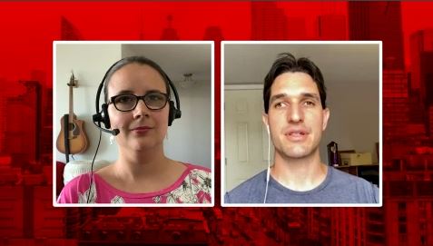A man and woman speak via Zoom.