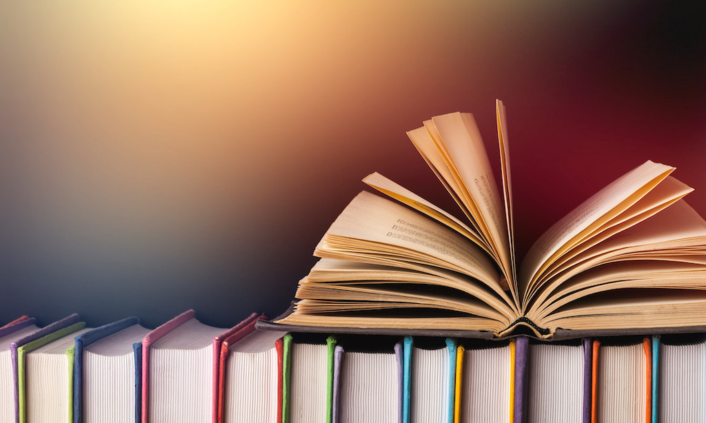 An open book on a bookshelf