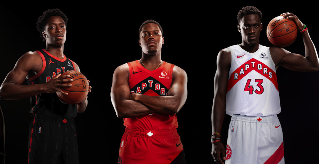 OG Anonoby, Kyle Lowry and Pascal Siakim posing in Raptors uniforms