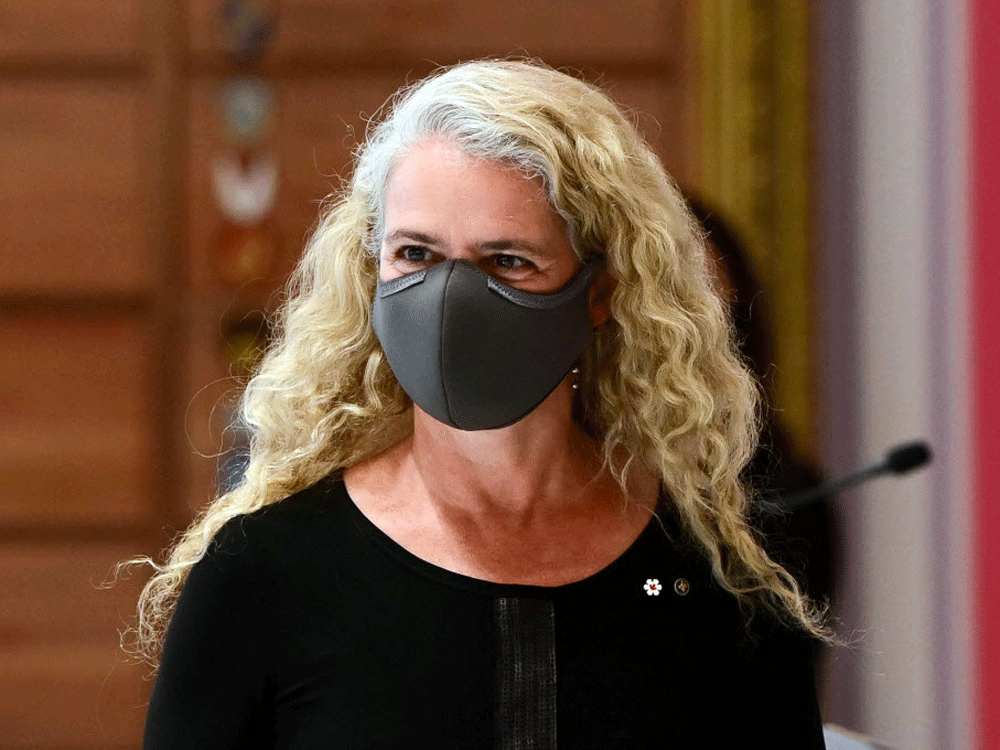 Julie Payette wearing a black face mask. 