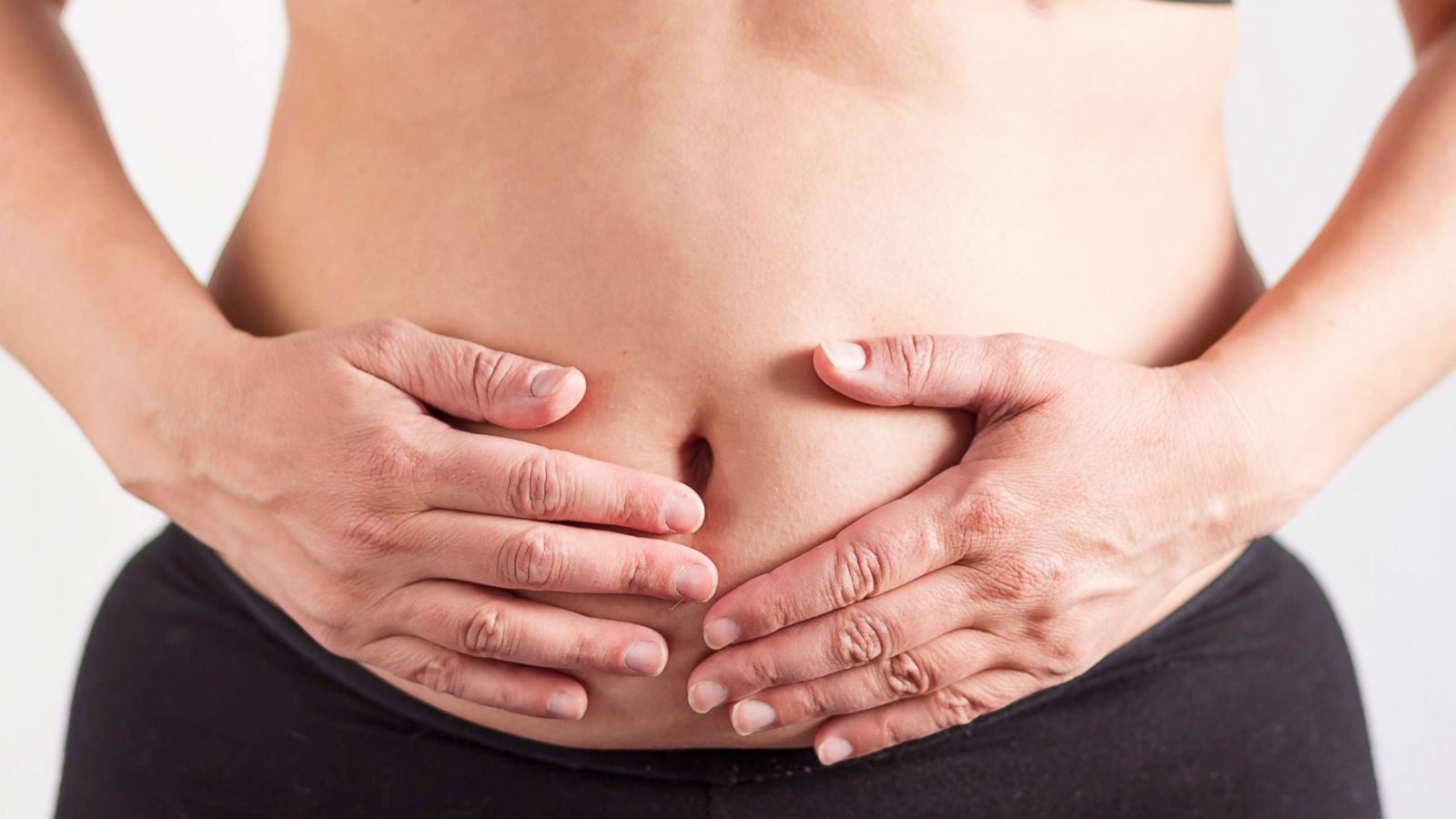 Someone holding their stomach