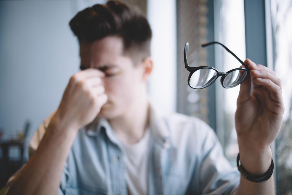 A man struggling to read
