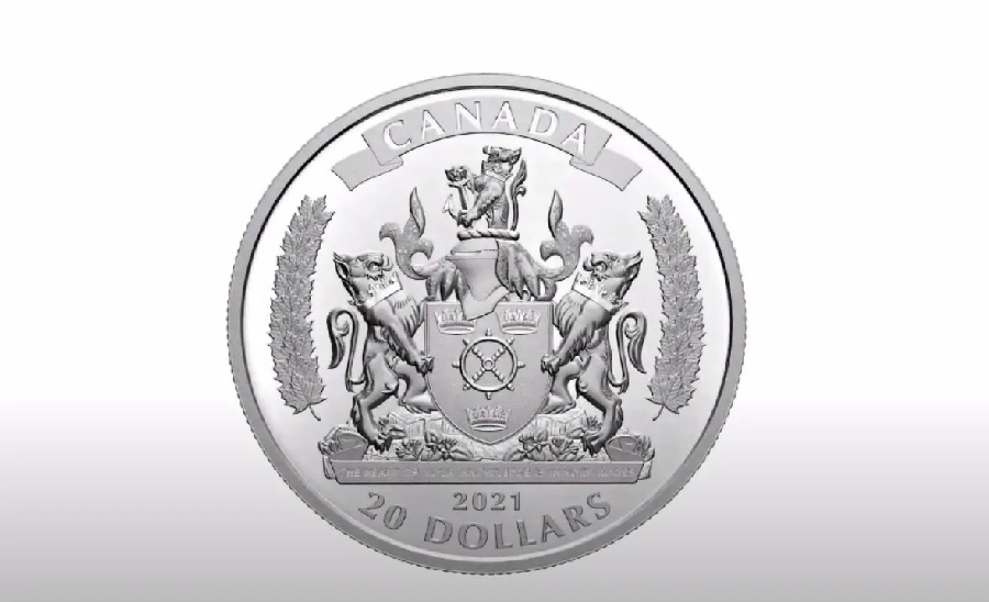 A $20 silver coin with the coat of arms for Black Loyalist Heritage Society and their motto: "The heart of your knowledge is in your roots."
