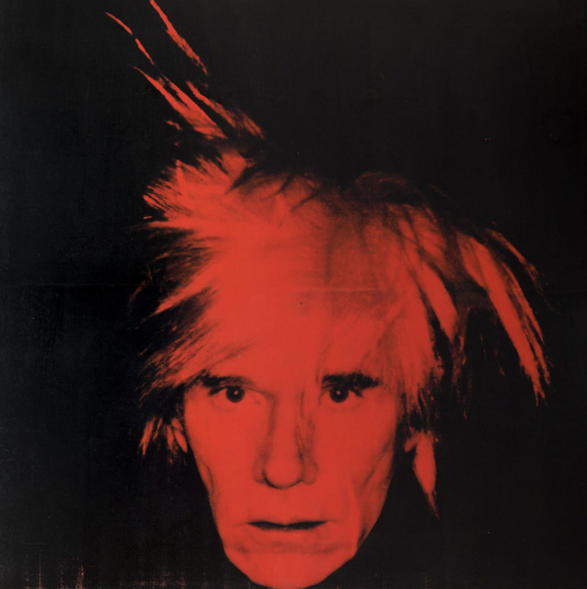 A red-coloured headshot of Andy Warhol