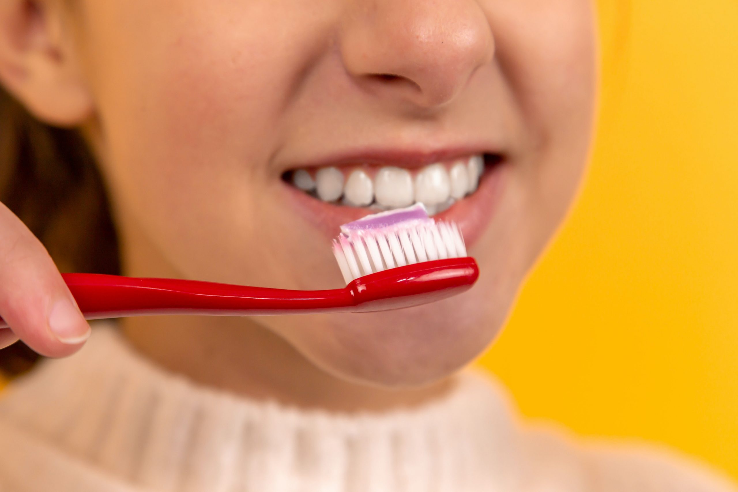 A girl brushing her teeth