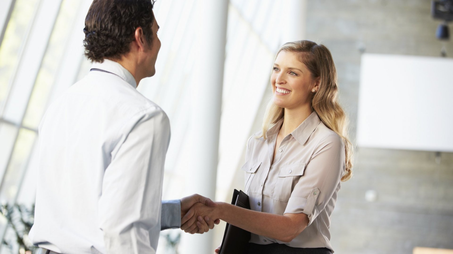 a man and women shaking hands